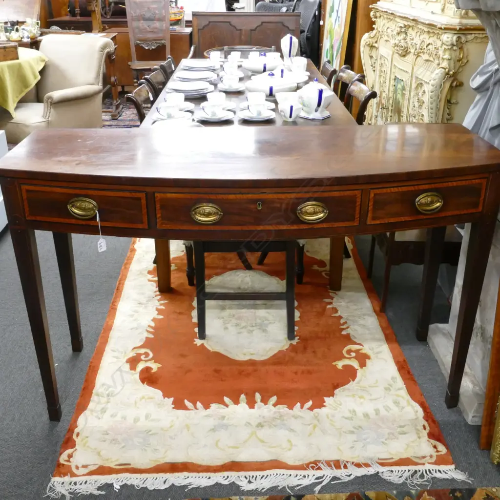 A Victorian mahogany bowfront console table Image 1++