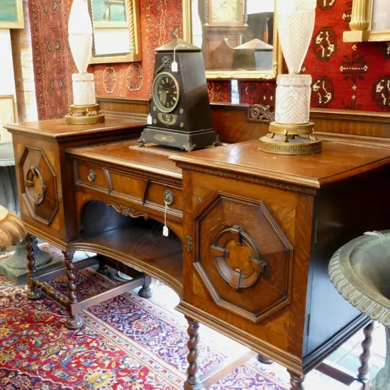 An English Waring and Gillows c.1910 oak breakfront sideboard