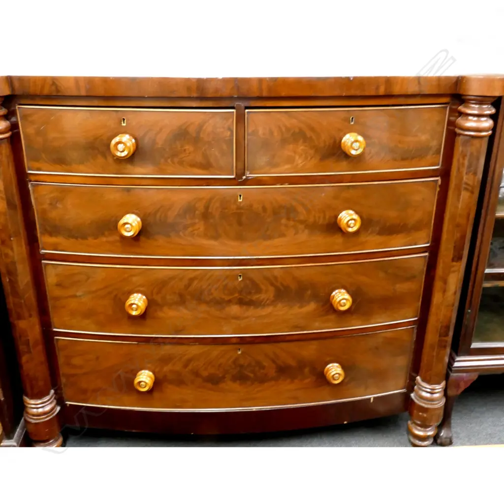 A Victorian mahogany bowfront chest of five drawers Image 1++