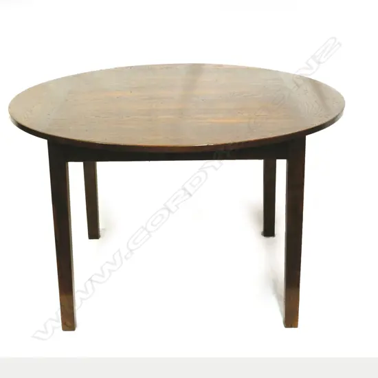 An oak country style circular dining table