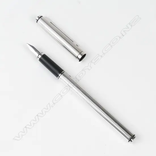 A Pelikan silver plate fountain pen
