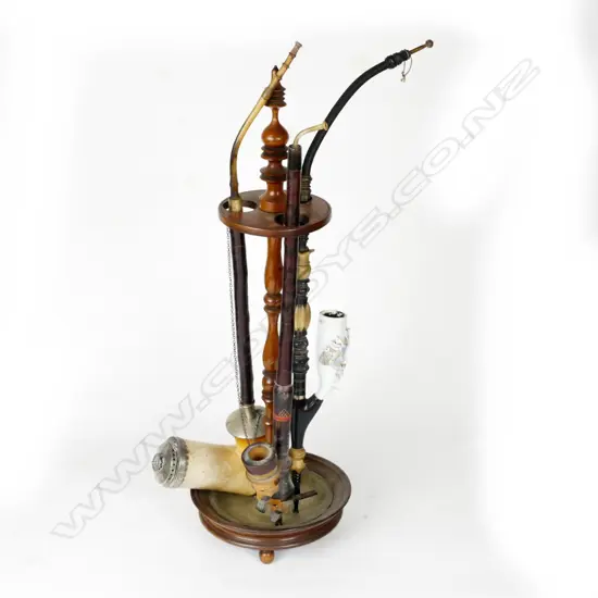 A vintage turned wood pipe stand