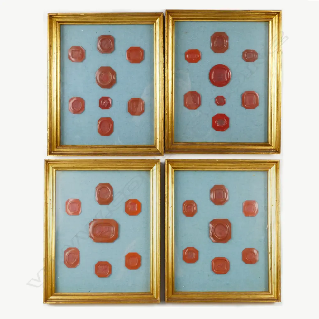 Four displays of wax seal impressions Image 1++