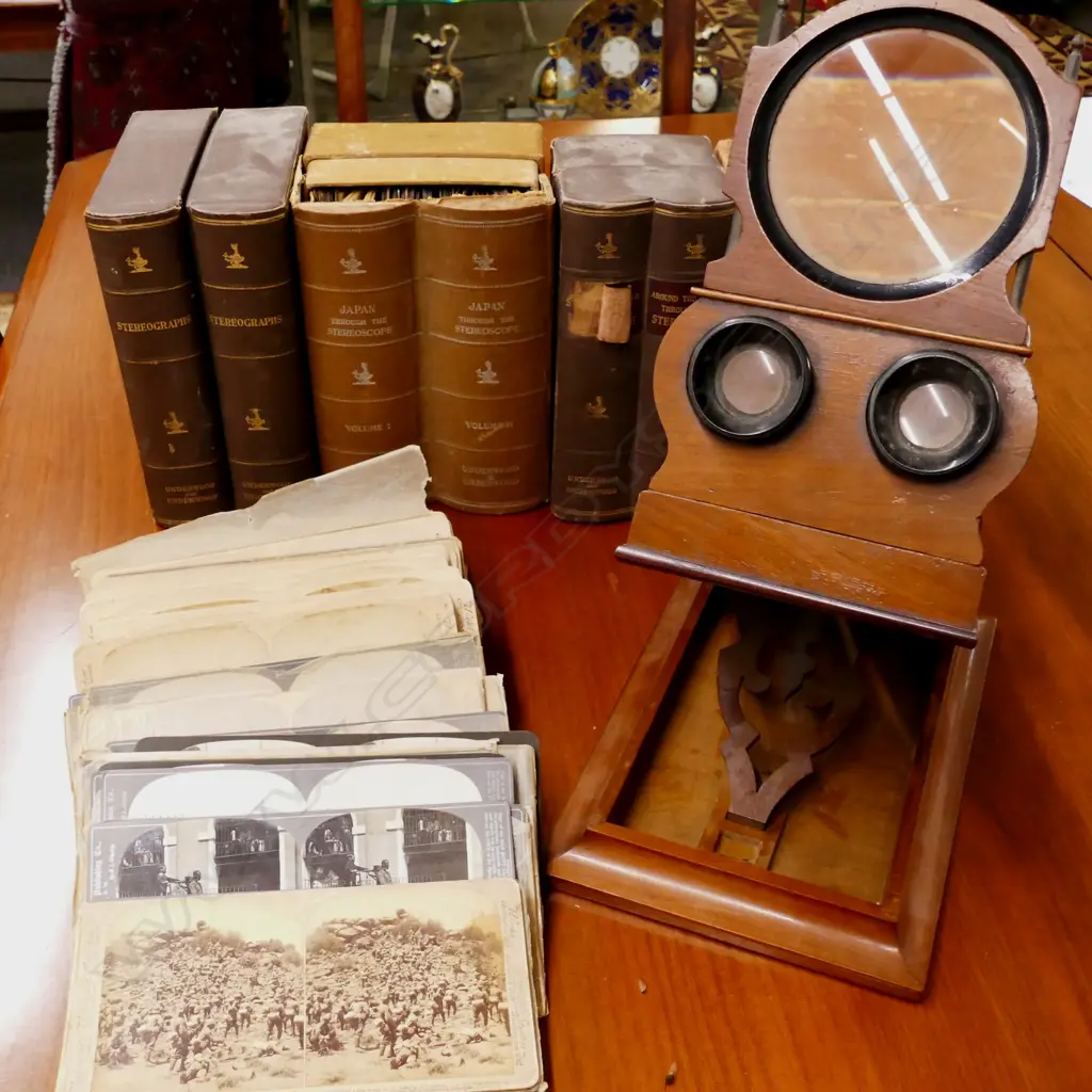 A Victorian stereoscope viewer together with a large selection of cards Image 1++