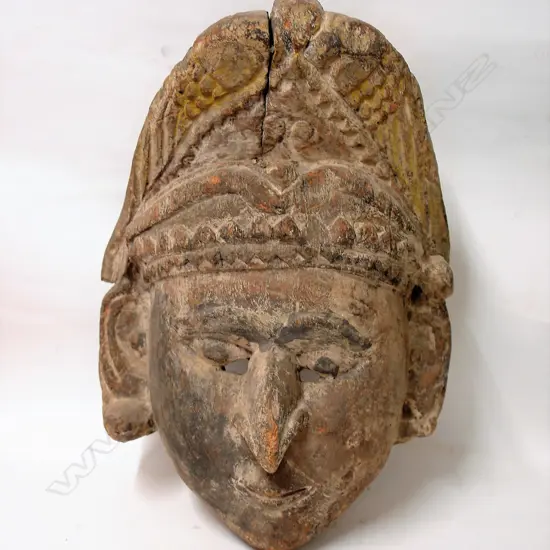 An old large carved wood Indian mask