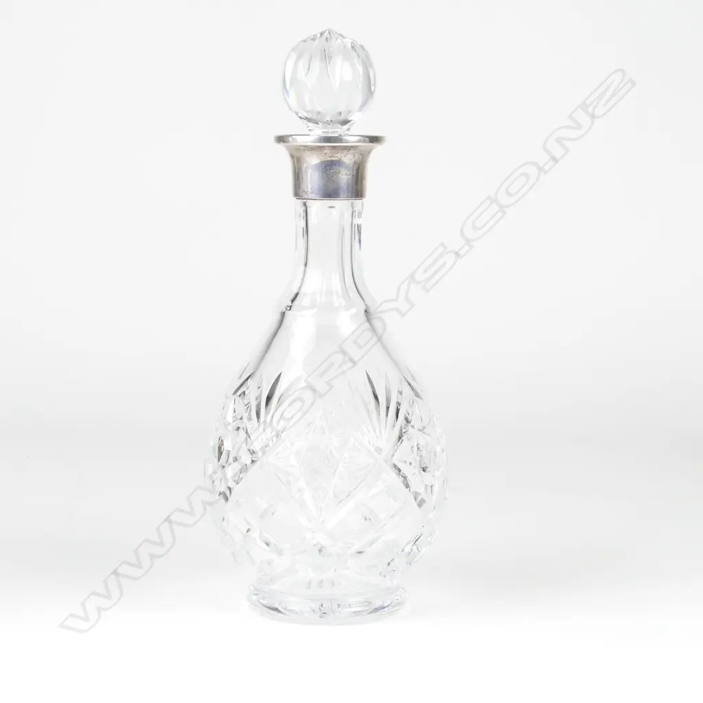 A crystal and silver spirit decanter Image 1++