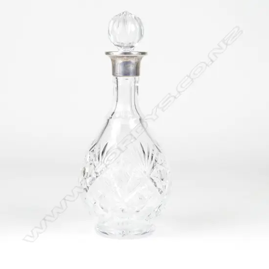 A crystal and silver spirit decanter