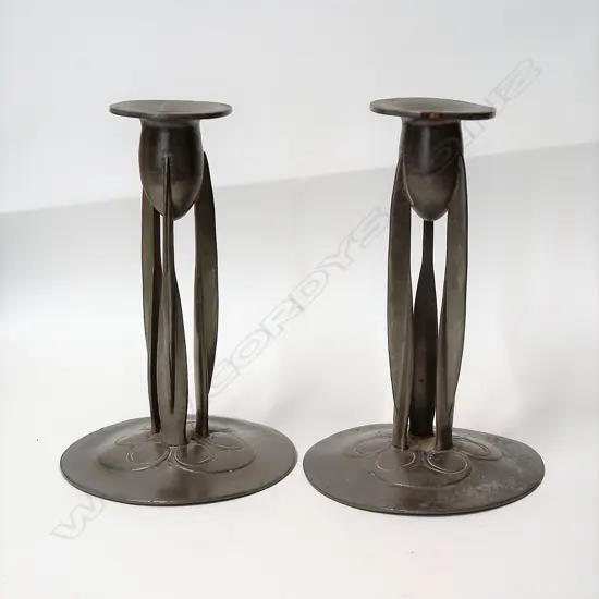 A pair of Archibald Knox English (Tudric) pewter candlesticks c.1902-1905