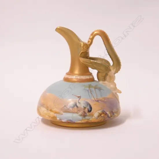 A 1912 Royal Worcester small ewer jug painted with storks by William Powell