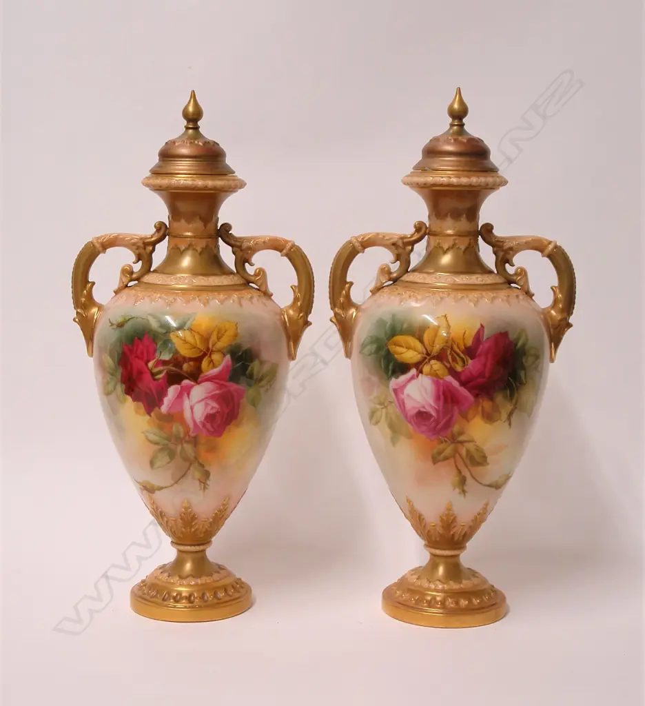 A pair of early 20thC Royal Worcester rose painted lidded urns by W. Hart Image 1++