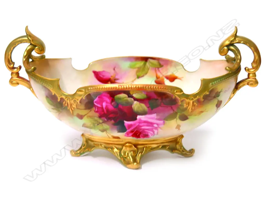 An Edwardian Royal Worcester boat form vase painted with roses by R. Austin Image 1++