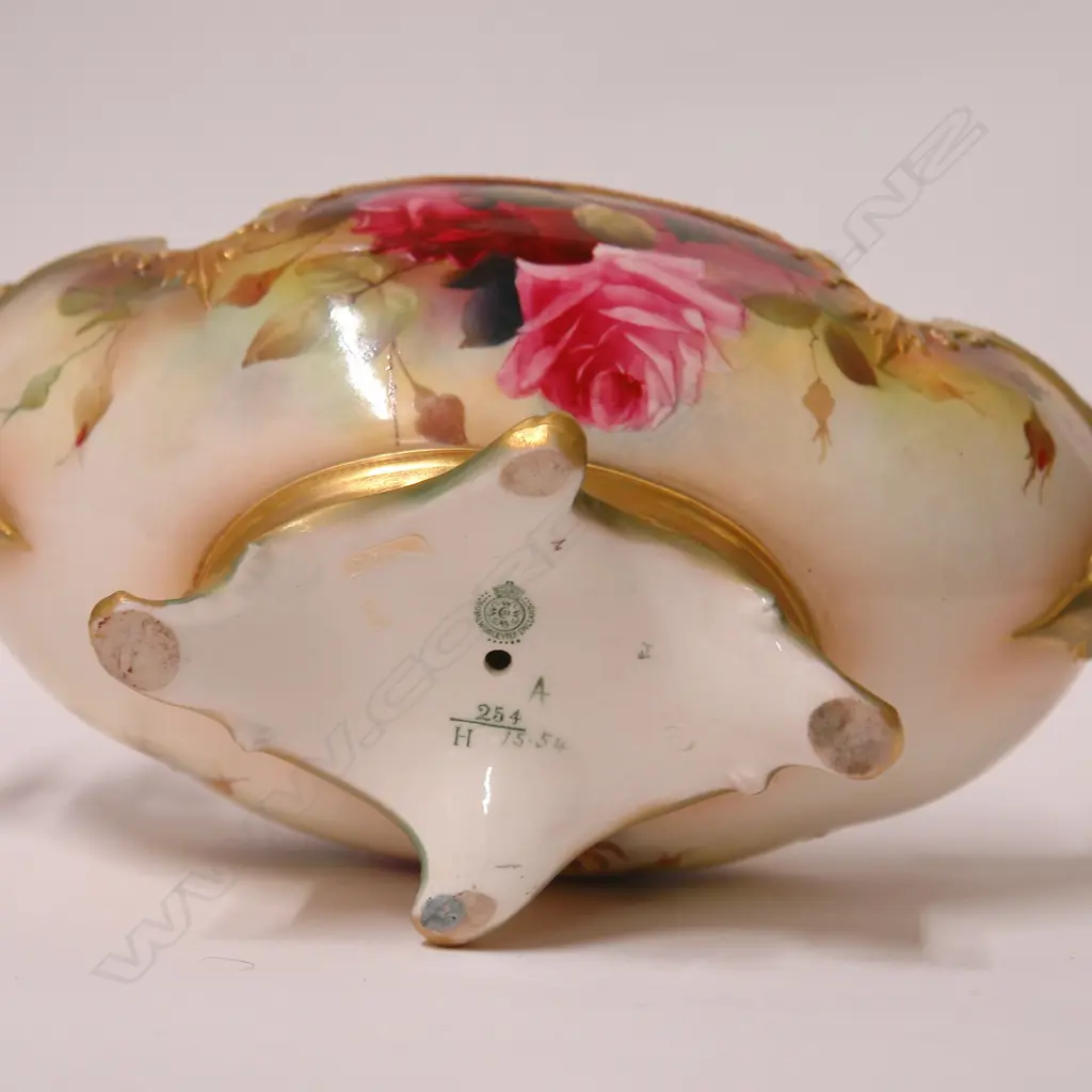 An Edwardian Royal Worcester boat form vase painted with roses by R. Austin Image 1++