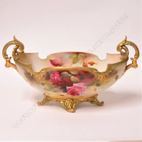 An Edwardian Royal Worcester boat form vase painted with roses by R. Austin