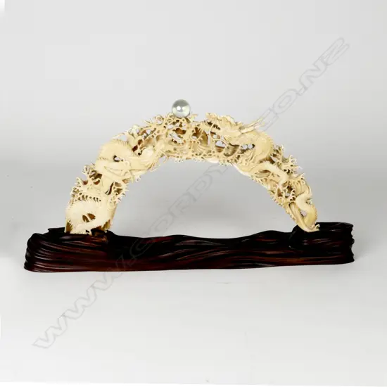 A large Chinese carved hippopotamus tusk