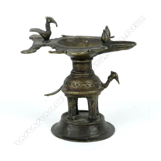 A bronze oil lamp