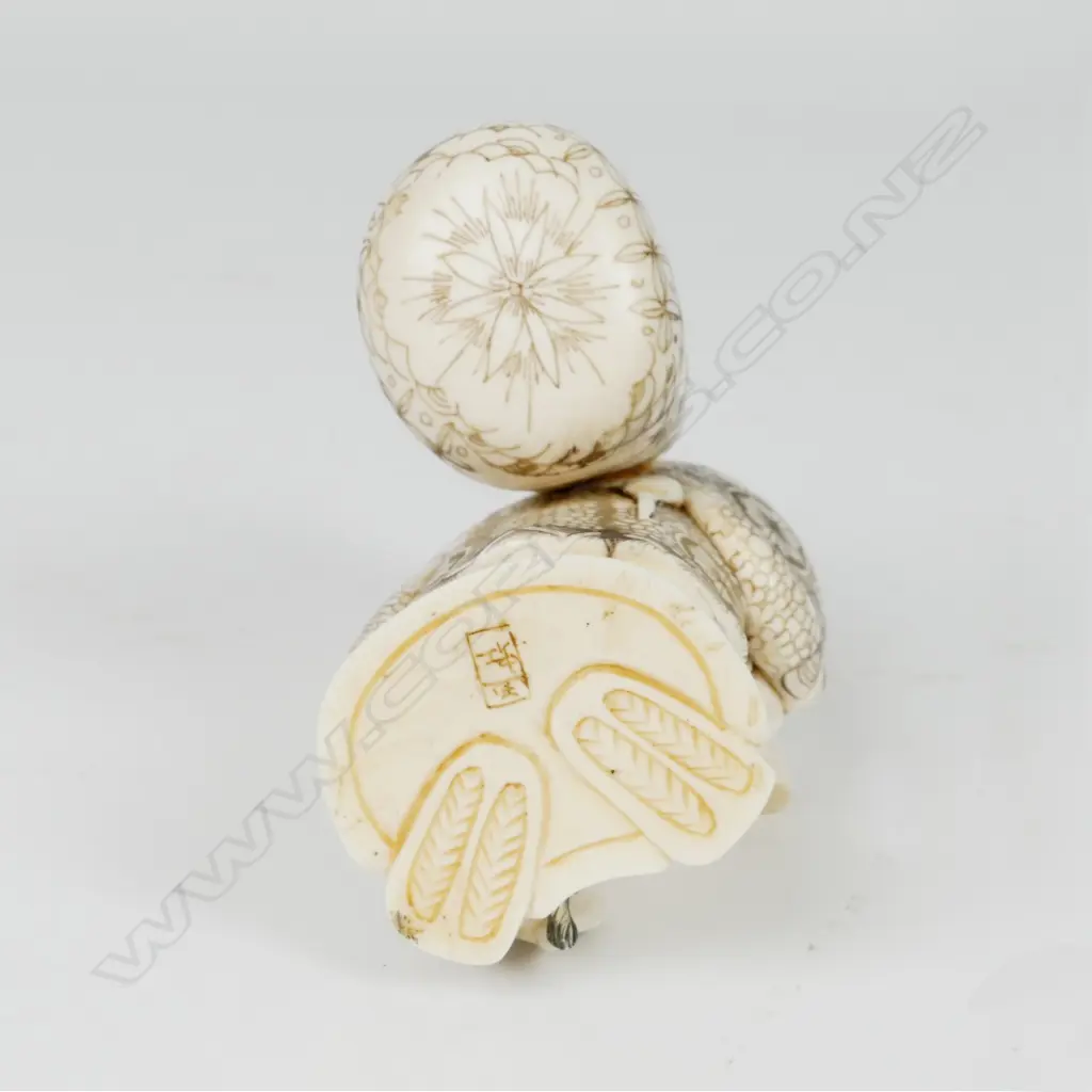 A Japanese ivory figure of Hotei Image 1++