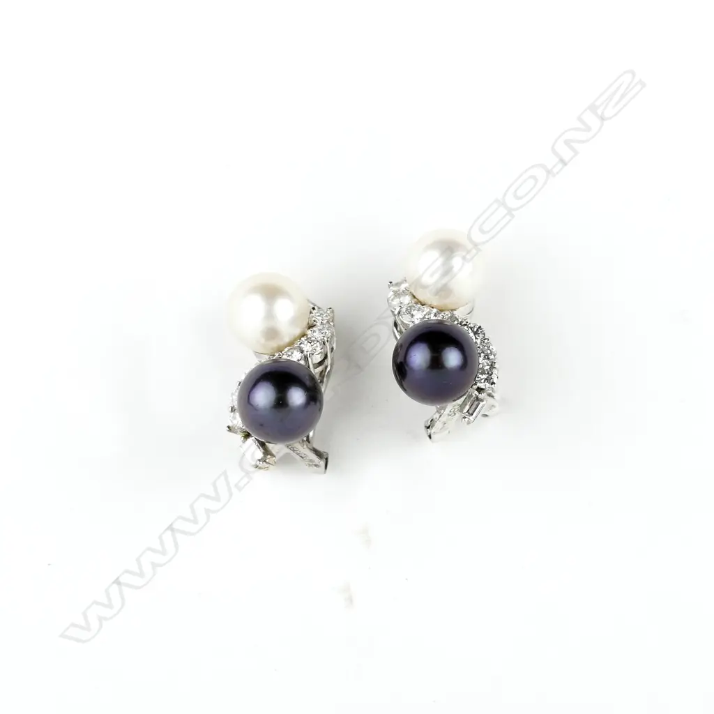 An impressive 14ct. white gold diamond and pearl ring and earrings suite Image 1++