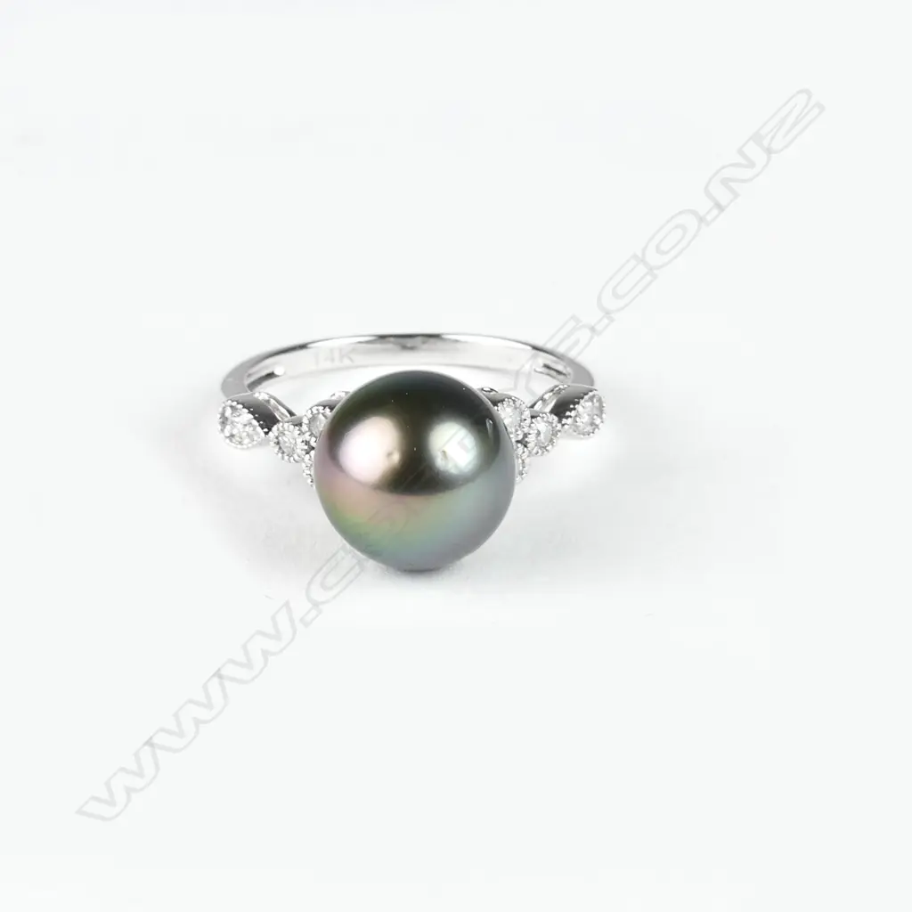 A 14ct. white gold diamond and pearl ring Image 1++