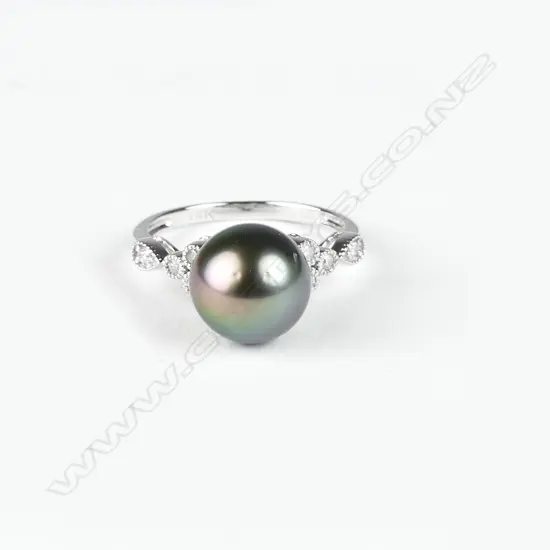 A 14ct. white gold diamond and pearl ring