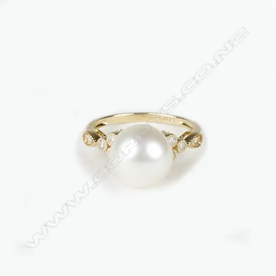 A 14ct. yellow gold diamond and pearl ring