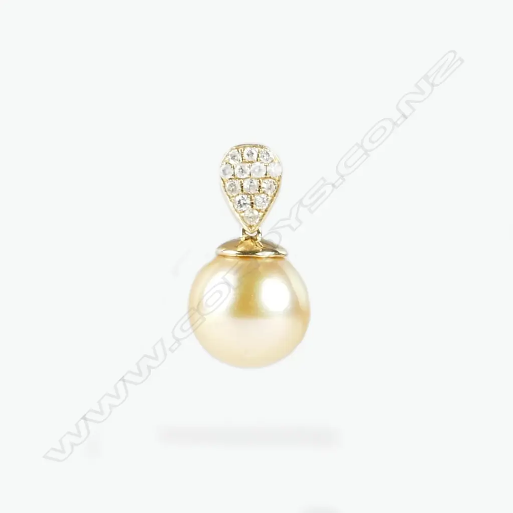 A 14ct. yellow gold diamond and pearl pendant Image 1++