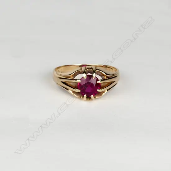 A gent's 18ct rose gold and faux ruby ring