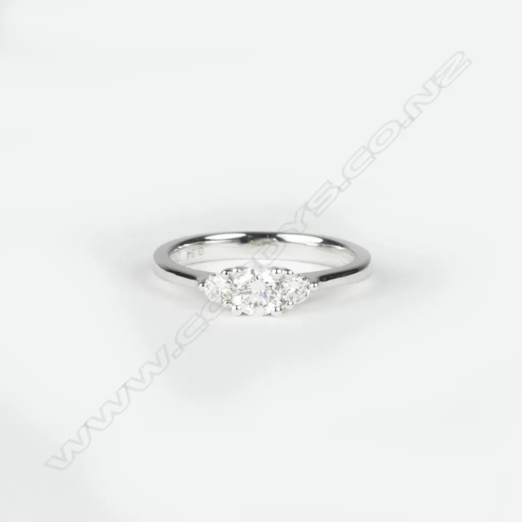 A 9ct. white gold and diamond trilogy ring Image 1++