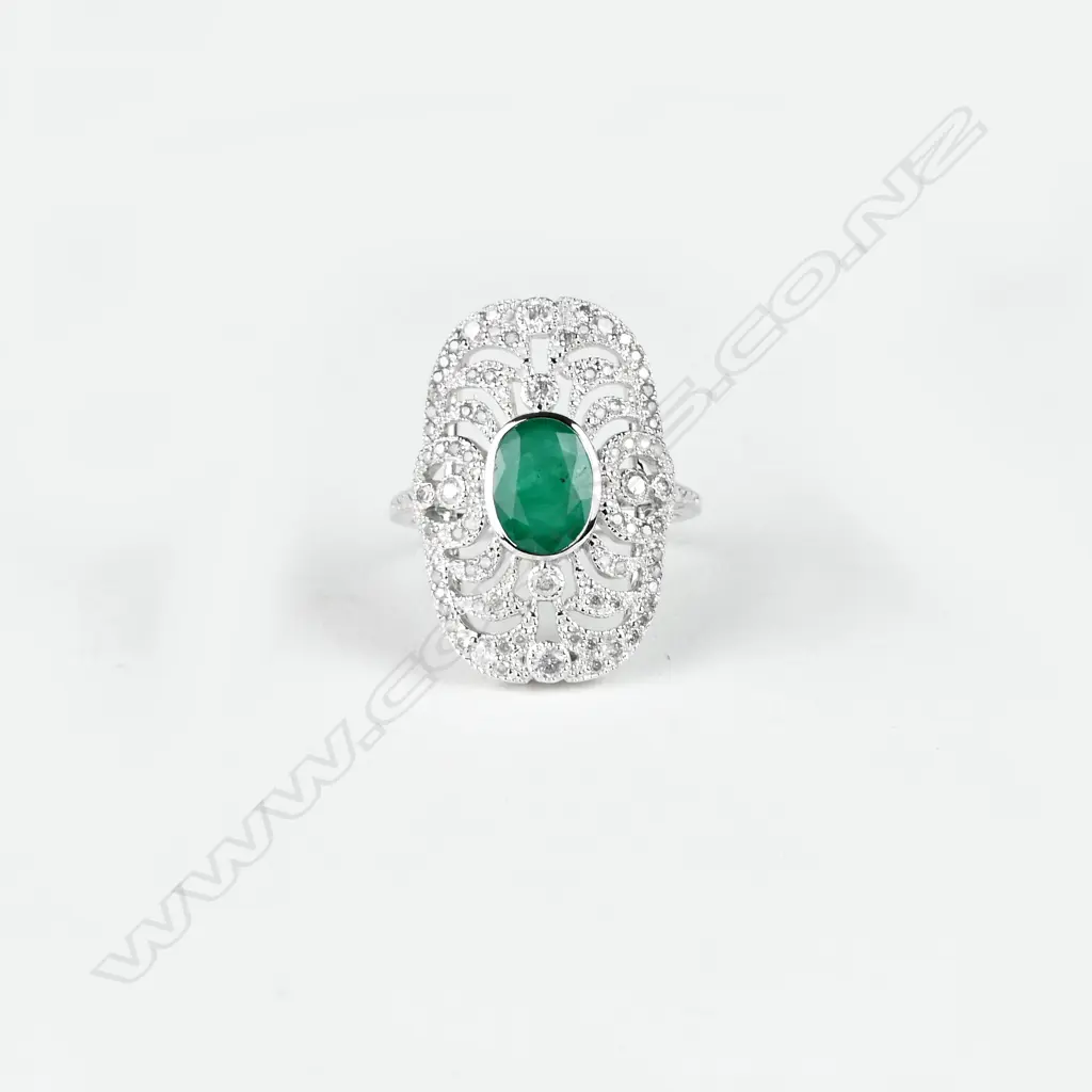 An 18ct. white gold emerald and diamond Art Deco style ring Image 1++