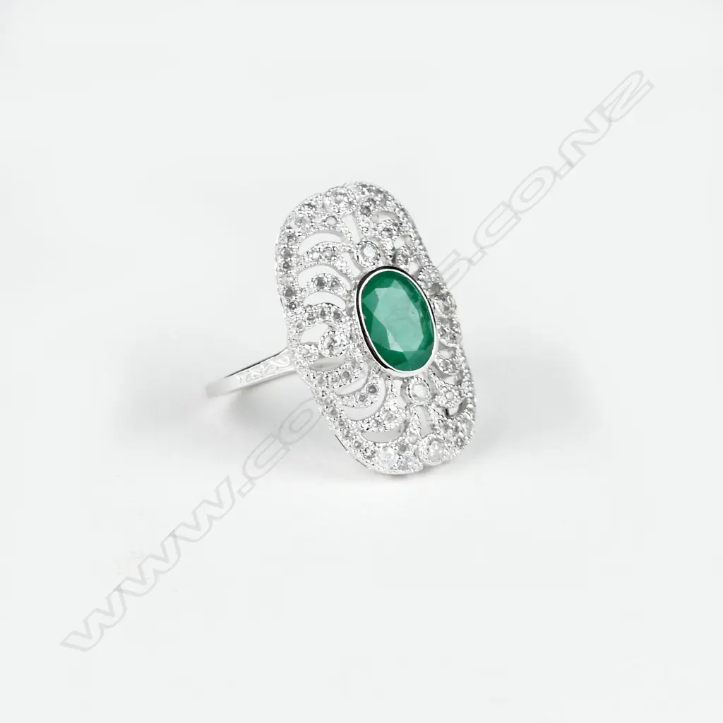 An 18ct. white gold emerald and diamond Art Deco style ring Image 1++