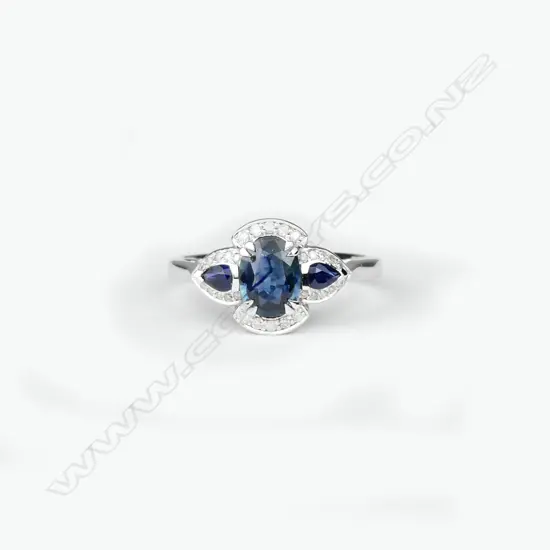 A 14ct. white gold sapphire and diamond ring