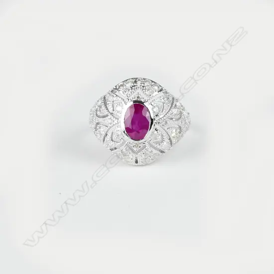 An 18ct. white gold ruby and diamond Art Deco style ring