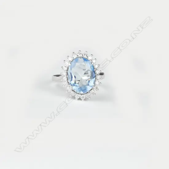 A 14ct. white gold aquamarine and diamond ring