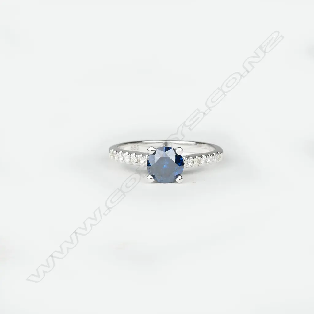 A 14ct. white gold and diamond ring Image 1++