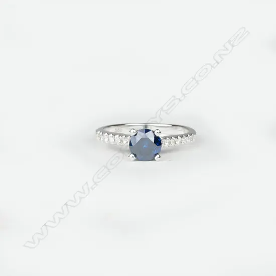 A 14ct. white gold and diamond ring