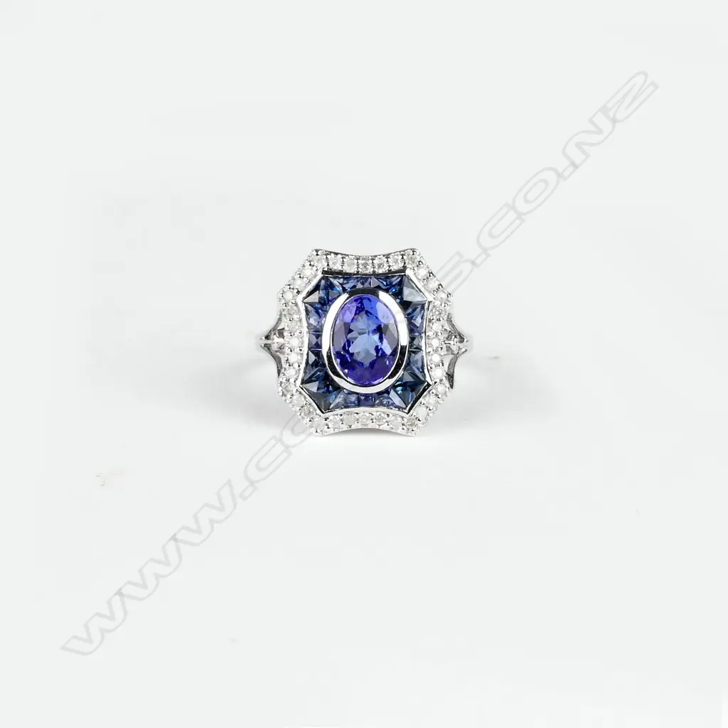 An 18ct. white gold tanzanite sapphire and diamond ring Image 1++
