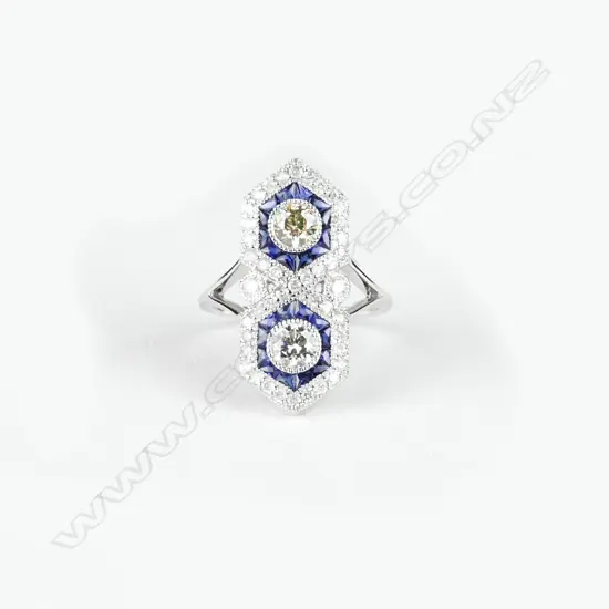 An 18ct. white gold diamond and sapphire art Deco style ring