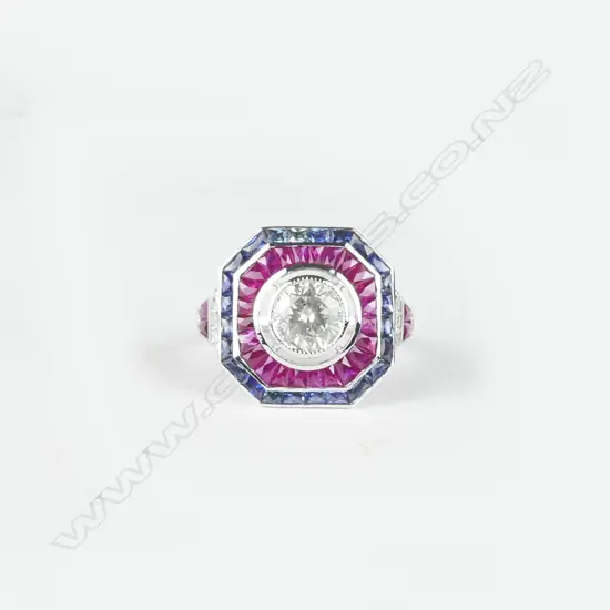 An 18ct. white gold diamond ruby and sapphire ring