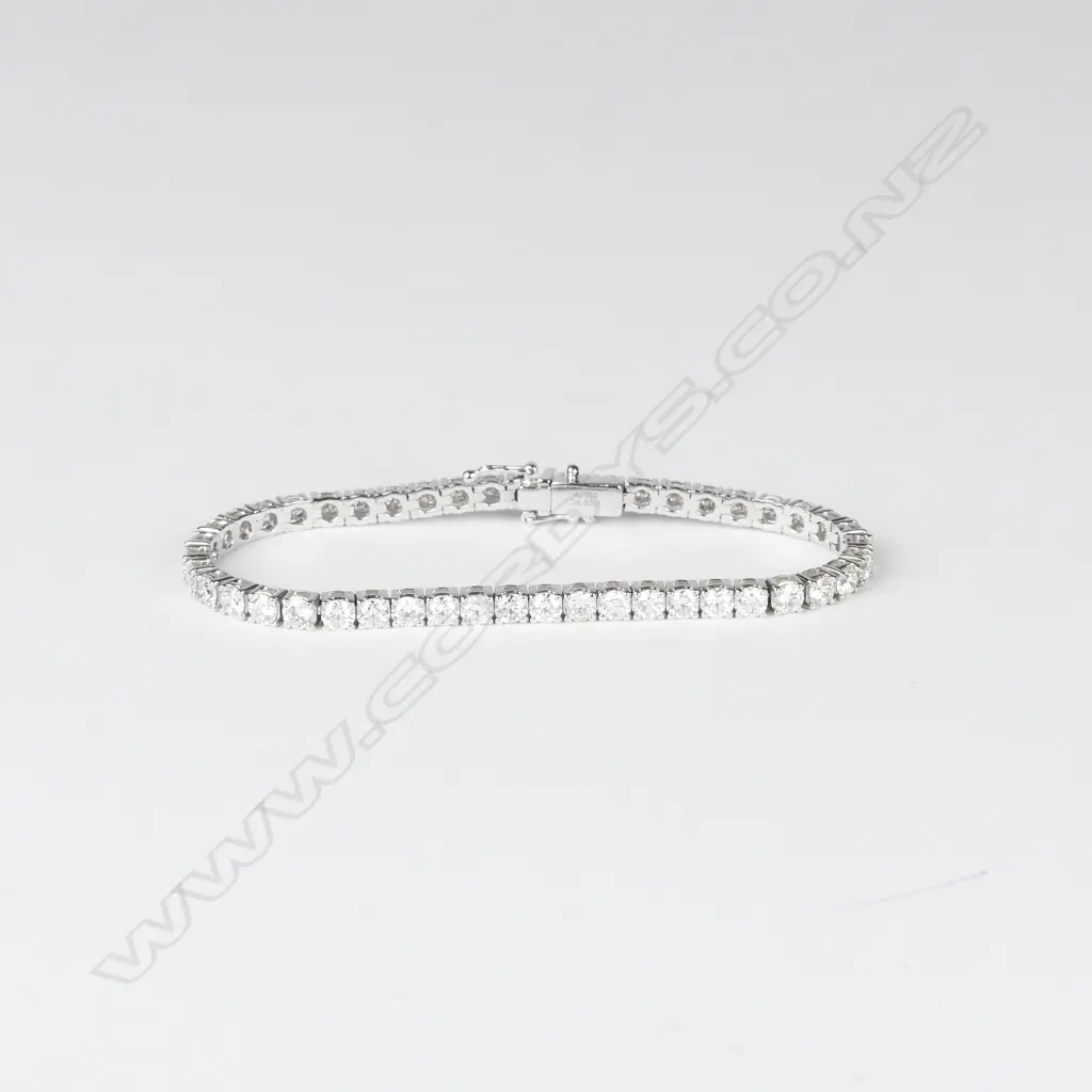 A good 18ct. white gold and 9.28ct diamond tennis bracelet Image 1++