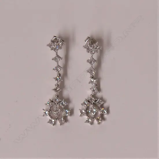 A pair of 18ct. white gold and diamond set drop earrings