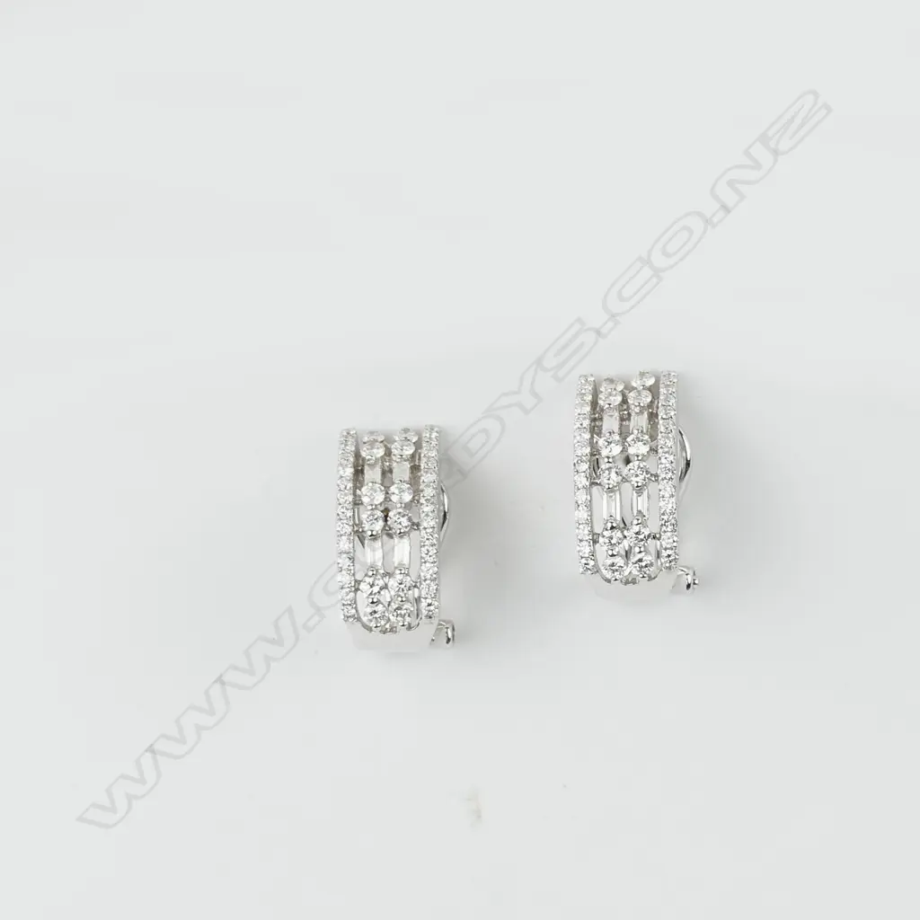 A pair of 18ct white gold and diamond earrings Image 1++
