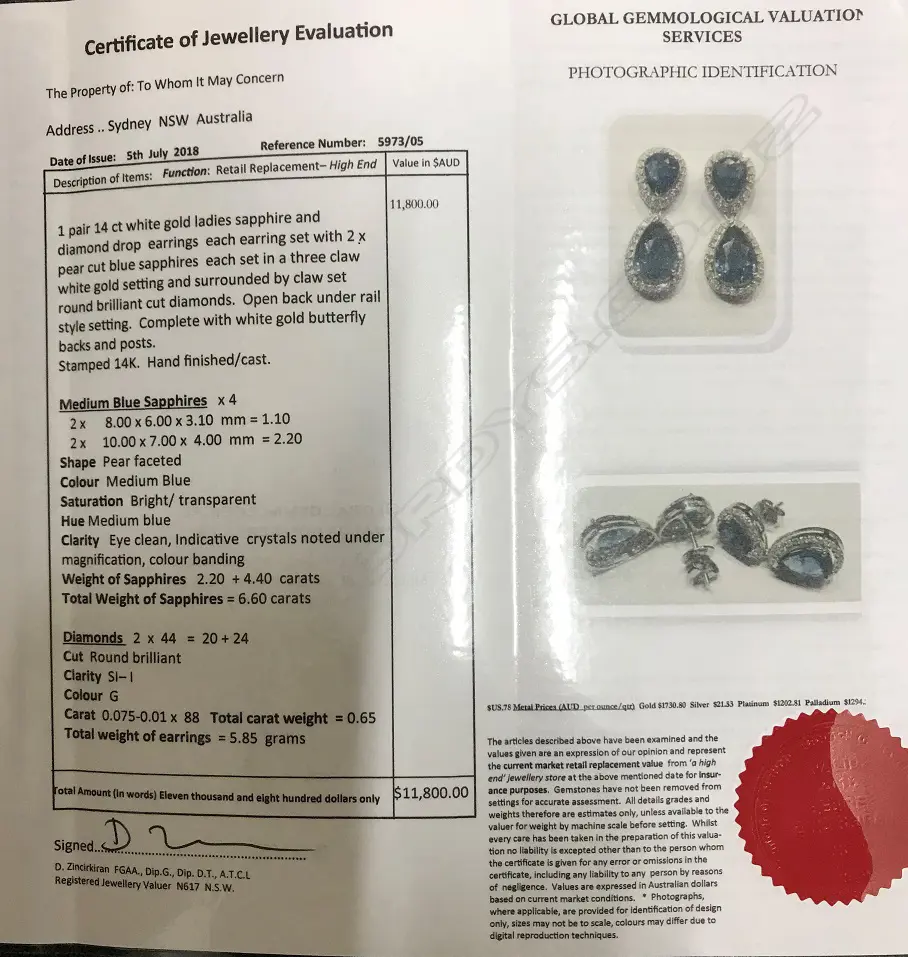 A pair of 14ct. white gold sapphire and diamond drop earrings Image 1++