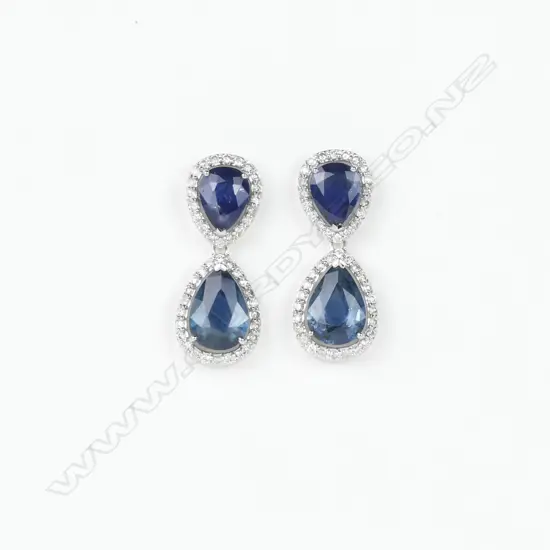 A pair of 14ct. white gold sapphire and diamond drop earrings