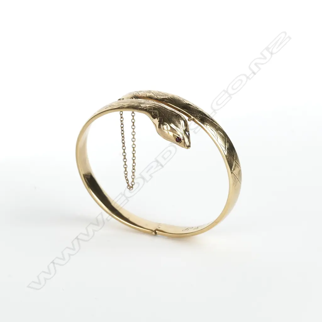 A vintage estate 9ct. yellow gold snake bangle Image 1++