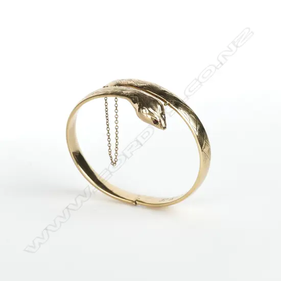 A vintage estate 9ct. yellow gold snake bangle
