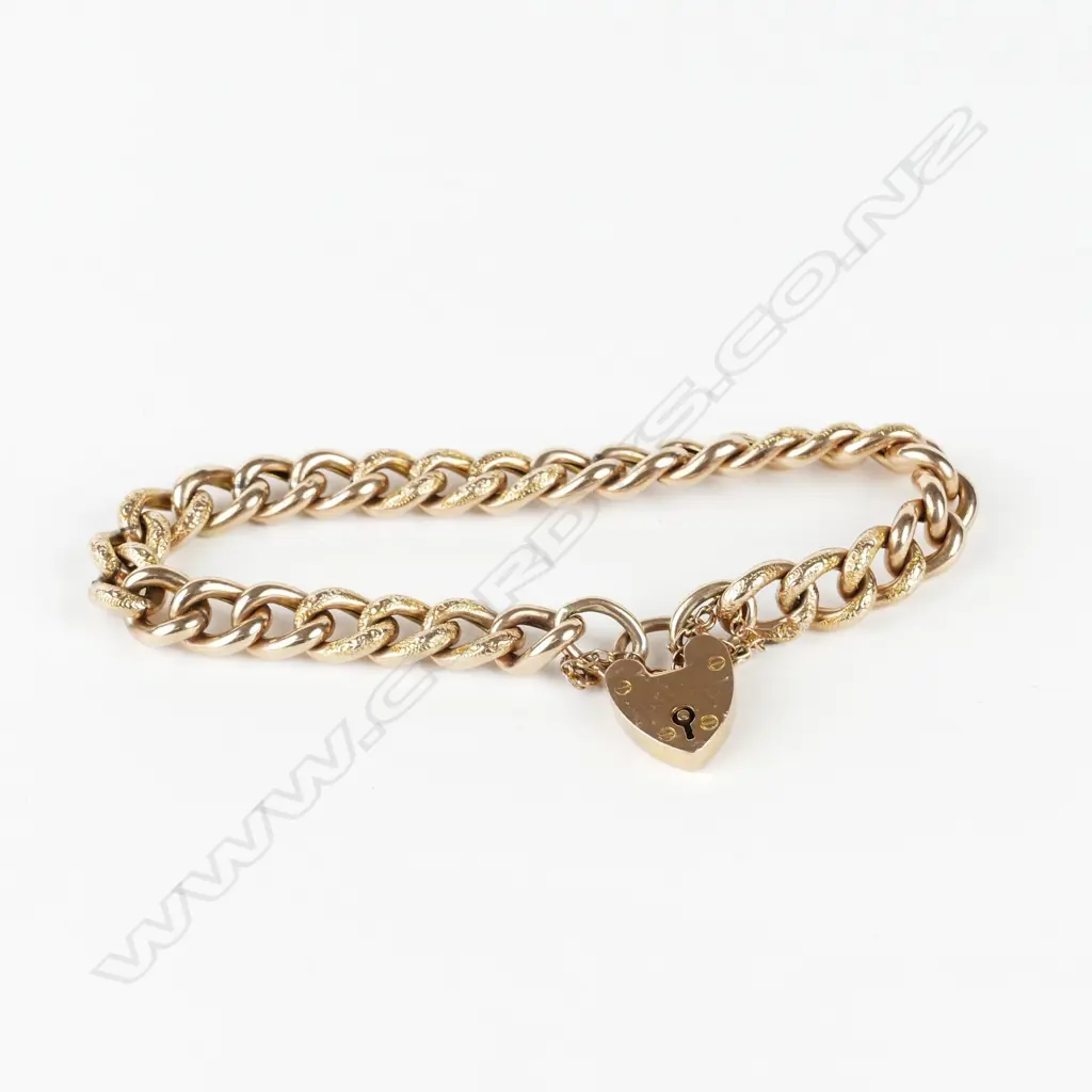 A 9ct. rose gold charm bracelet Image 1++