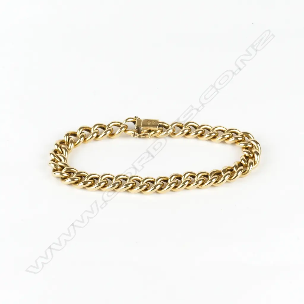 An 18ct. gold charm bracelet Image 1++