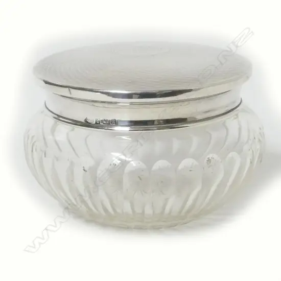 A silver lidded crystal jar