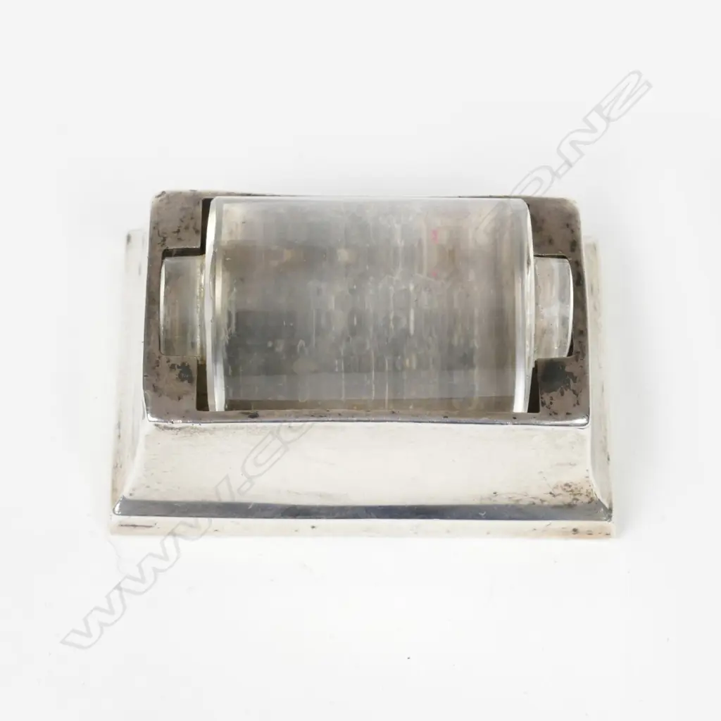 A silver stamp roller Image 1++