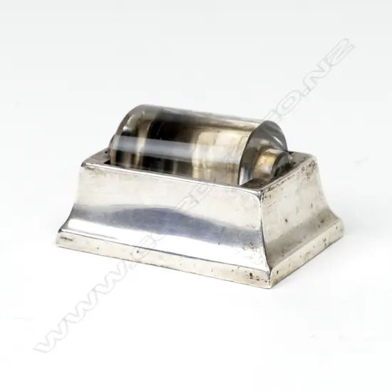 A silver stamp roller