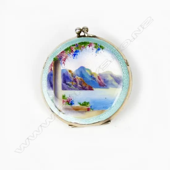 A silver and enamel powder compact
